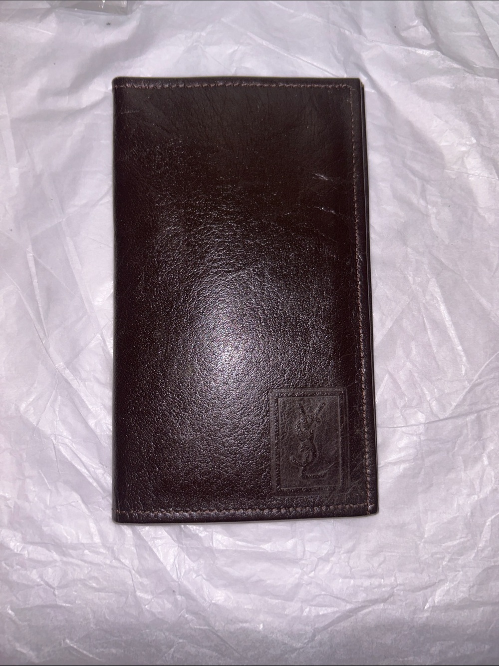 Yves Saint Laurent (YSL) vintage brown leather bifold wallet featuring an emboss